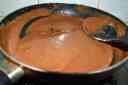 Stir until the mixture forms a gooey mass for the chocolate modak